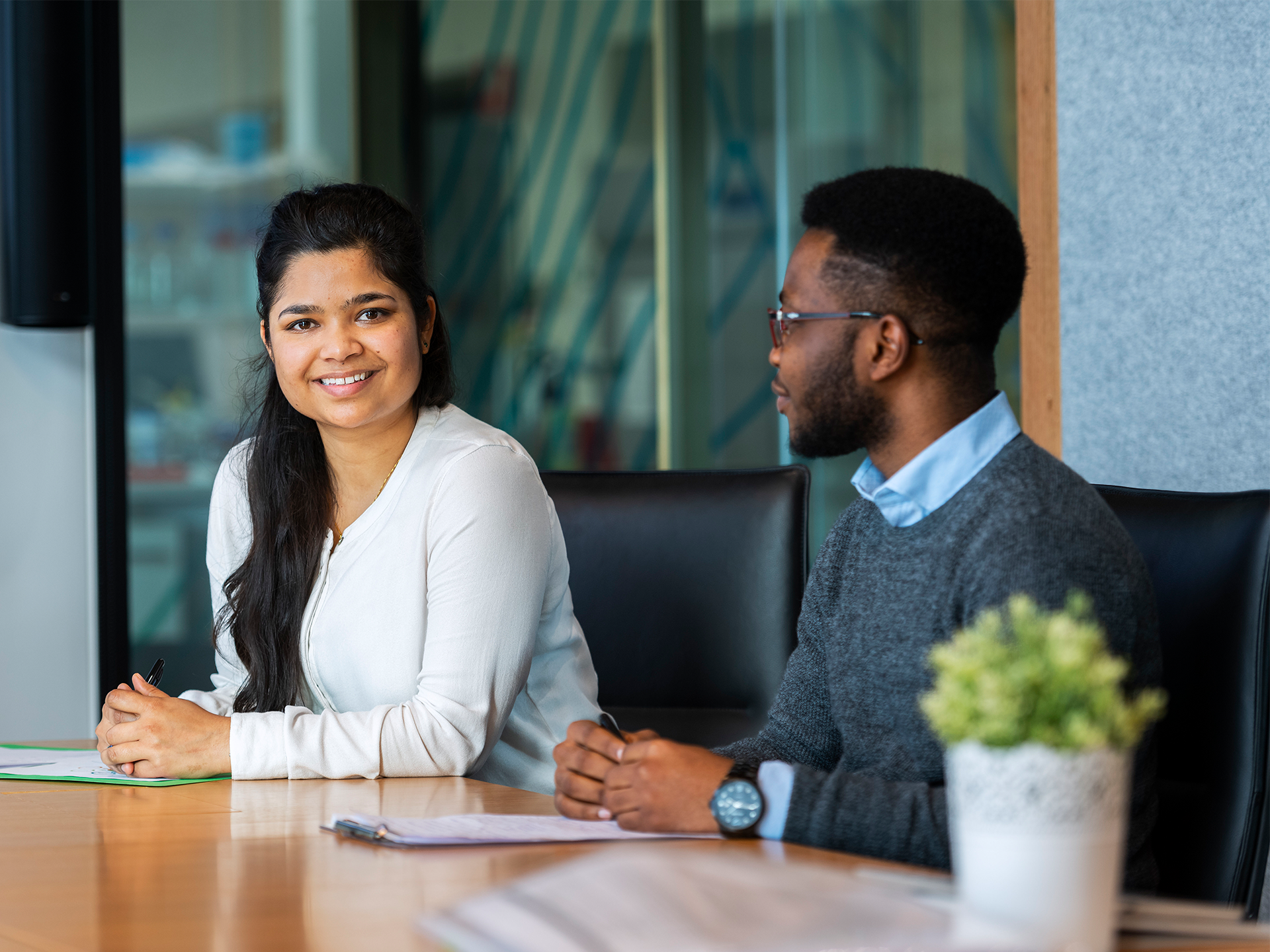 Two people sitting at a desk