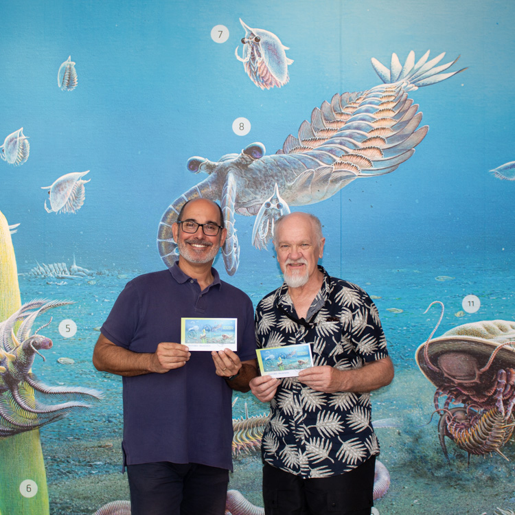 Artist Peter Truslker and  Adelaide University Associate Professor Diego Garcia-Bellido look at the new display in the South Australian Museum.